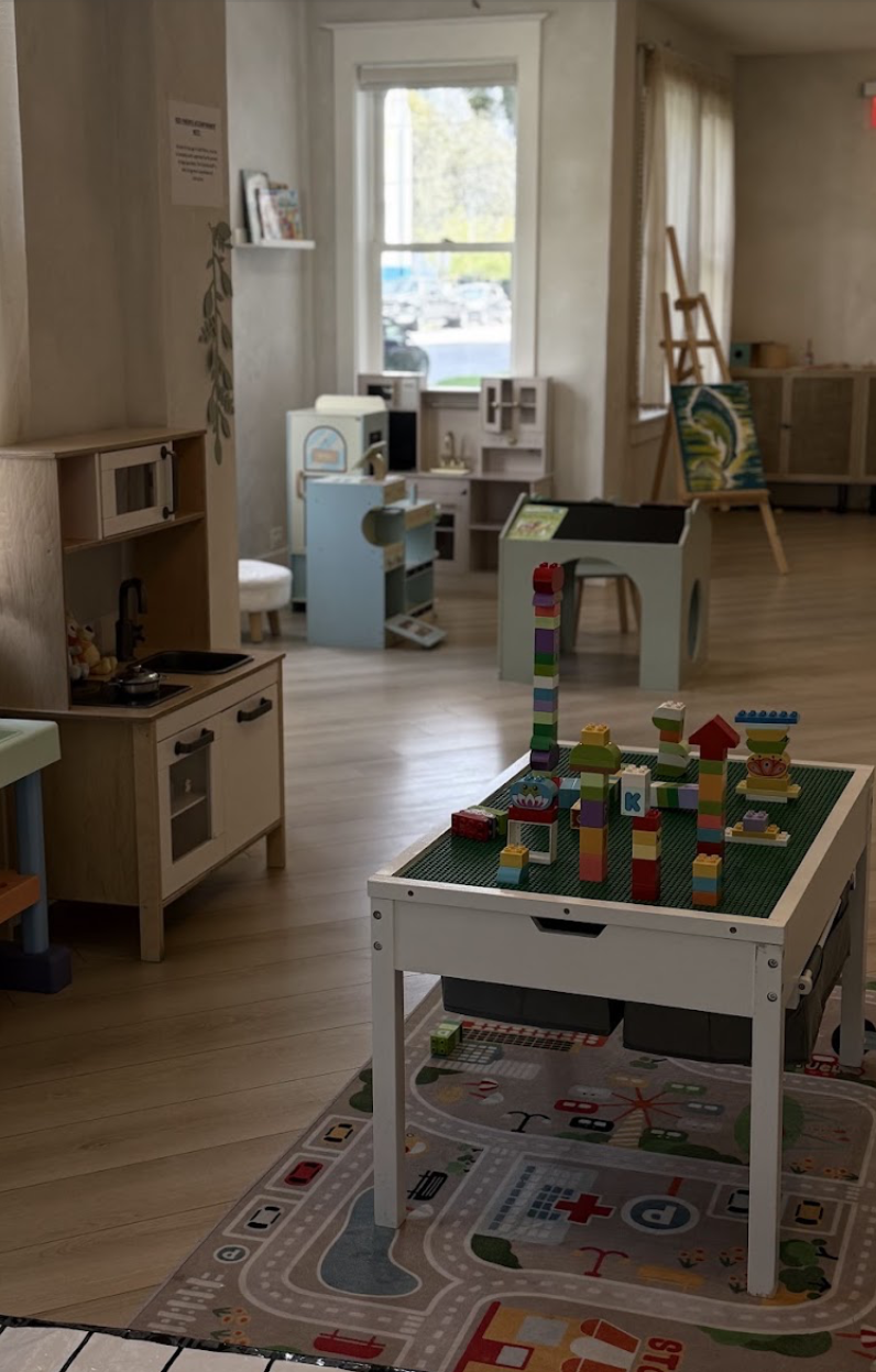 Pretend kitchen area and building table in the Play Area