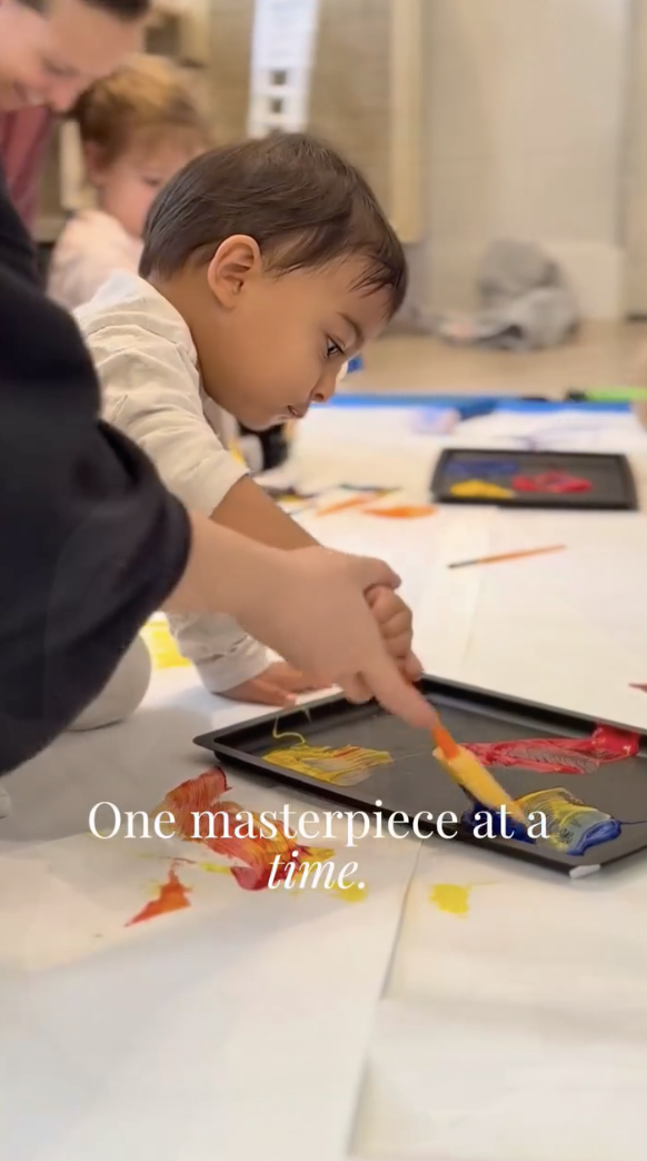 Toddler painting a masterpiece at LOULOU HOUSE