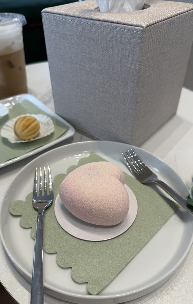 Heart-shaped mousse dessert plated on a scalloped napkin