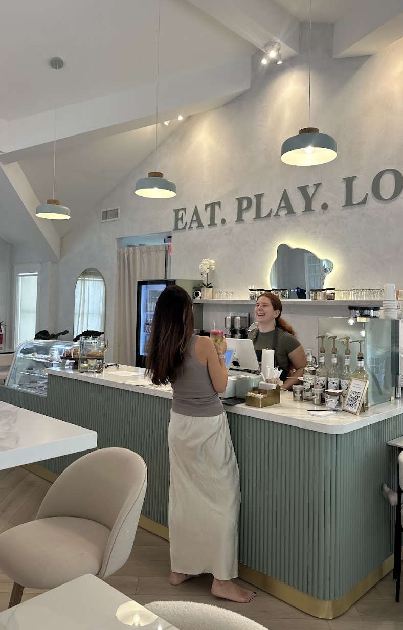Guest ordering a matcha at the LOULOU HOUSE cafe bar