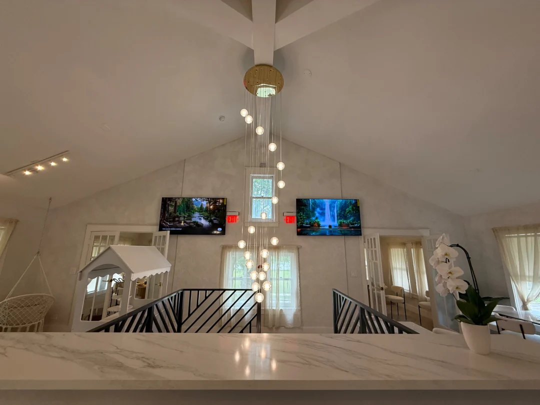 Upstairs private event space with cascading pendant lights